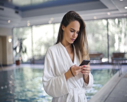 Smartphone showing SmartPlayCrown hotel and event information
